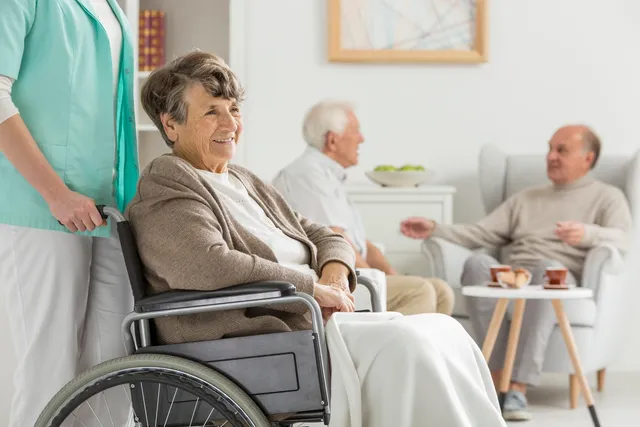 an old lady sitting on a wheelchair