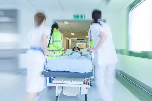 nurses rushing a patient in the hospital